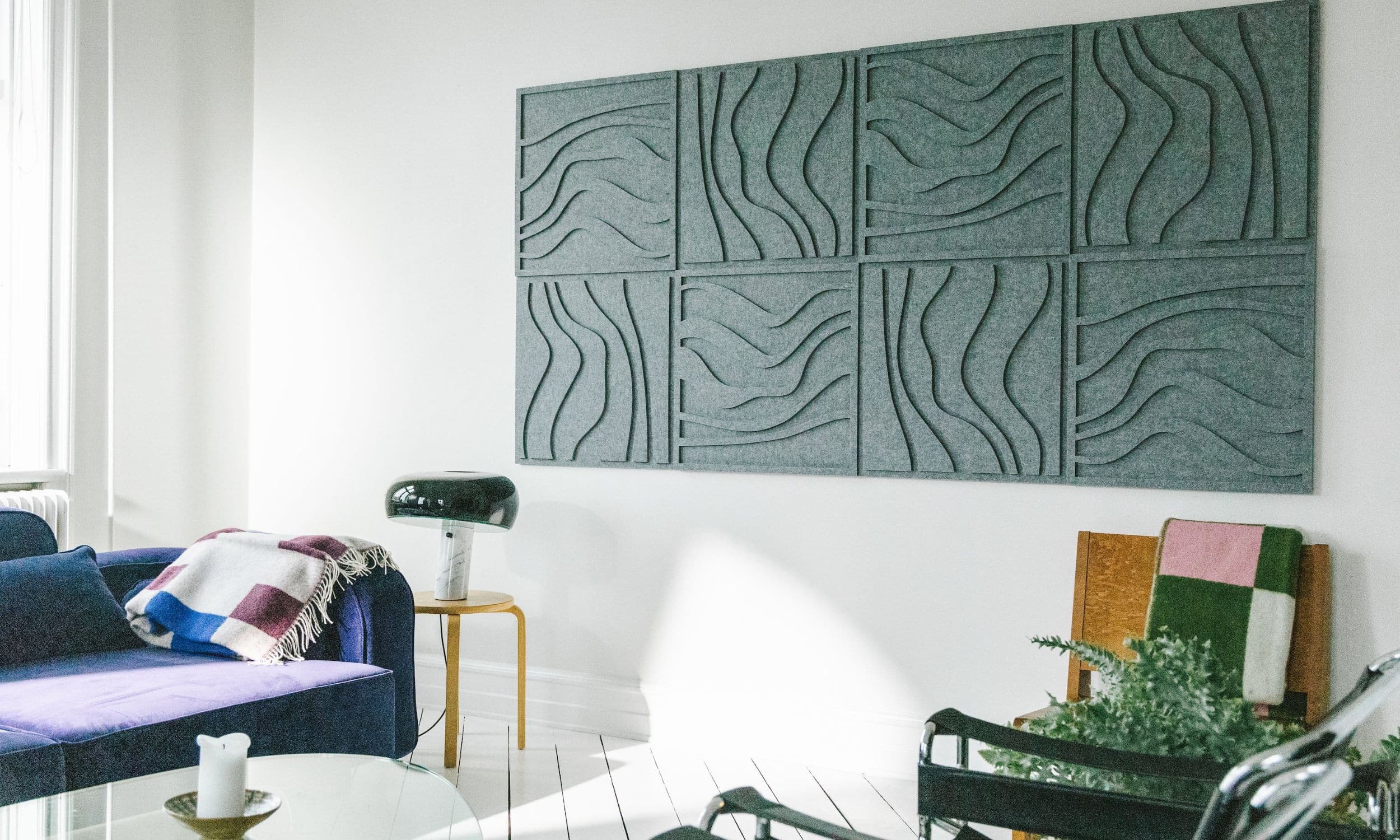 Green acoustic wave panels from Arturel, installed in a modern living room to enhance sound quality and complement the interior design